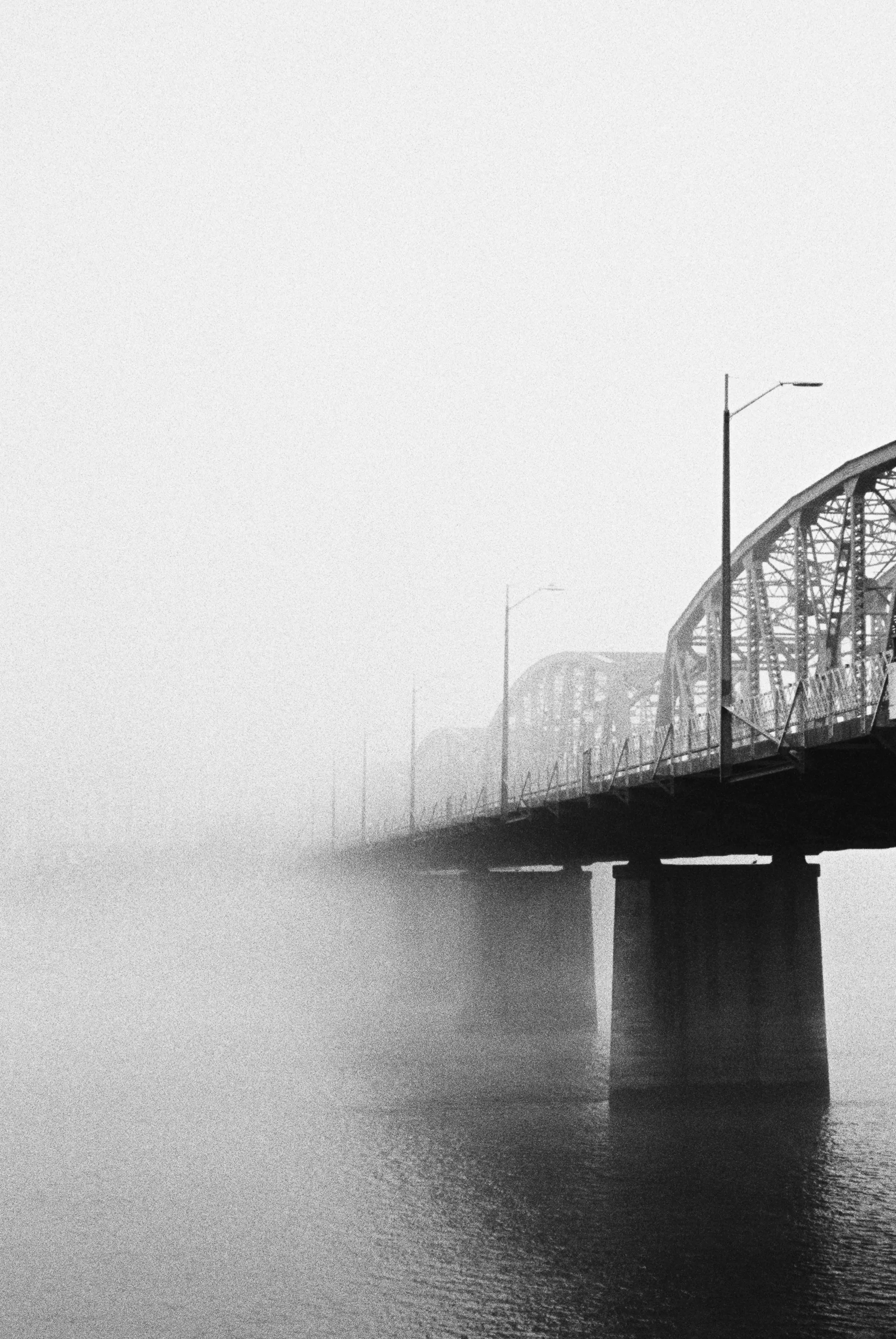 foggy bridge in black and white
